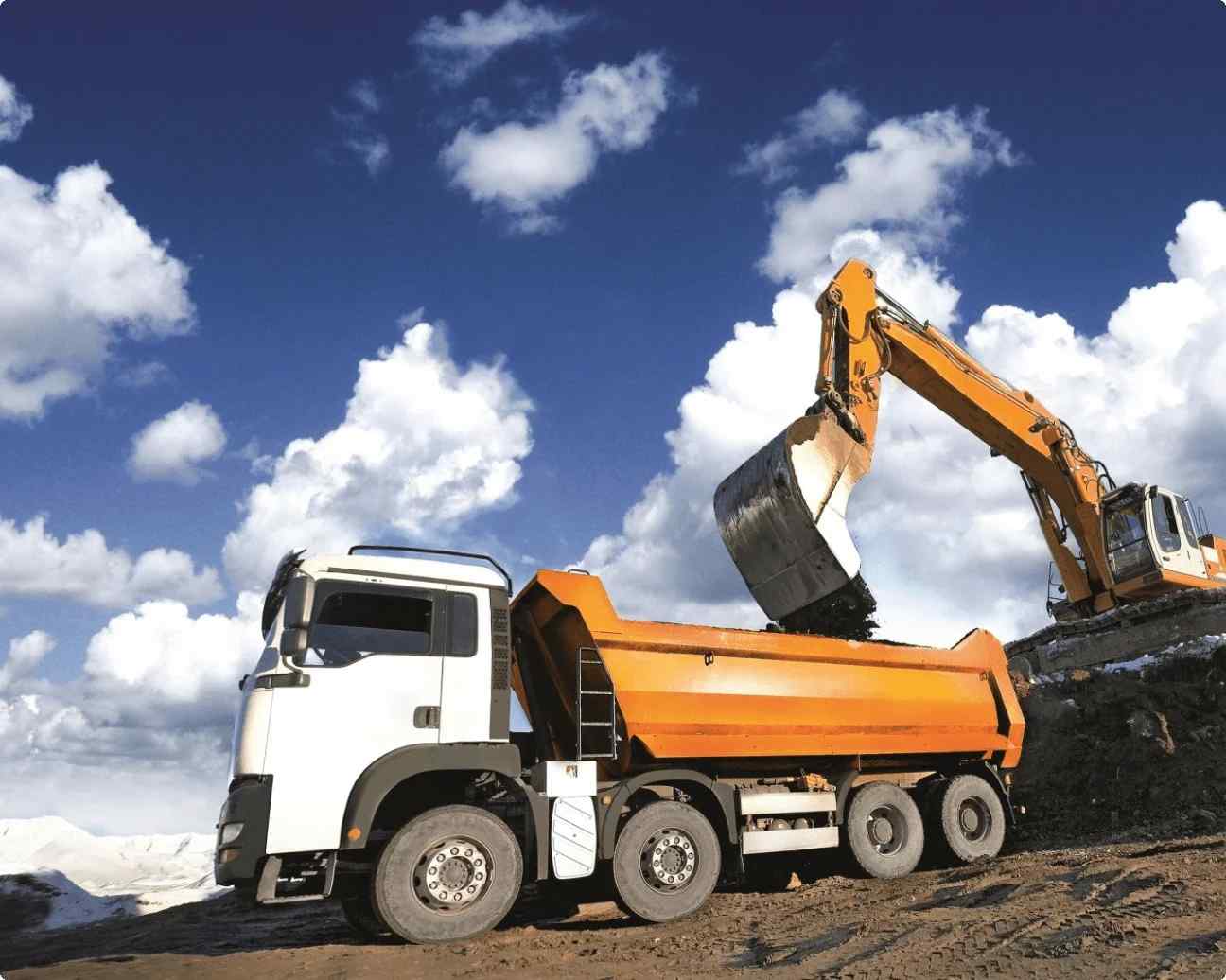 Tracking of moving assset - A yellow truck on construction site which is fully loaded shown in this image